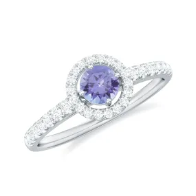 0.75 CT Tanzanite and Diamond Halo Engagement Ring