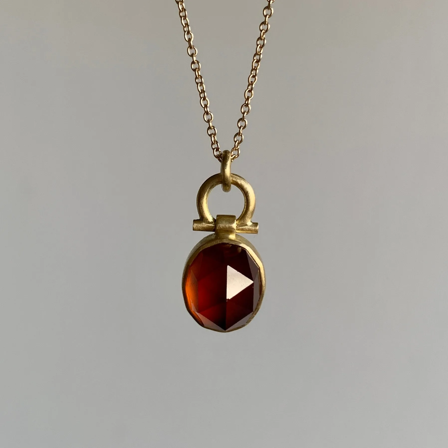 Faceted Oval Hessonite Garnet Dome Pendant