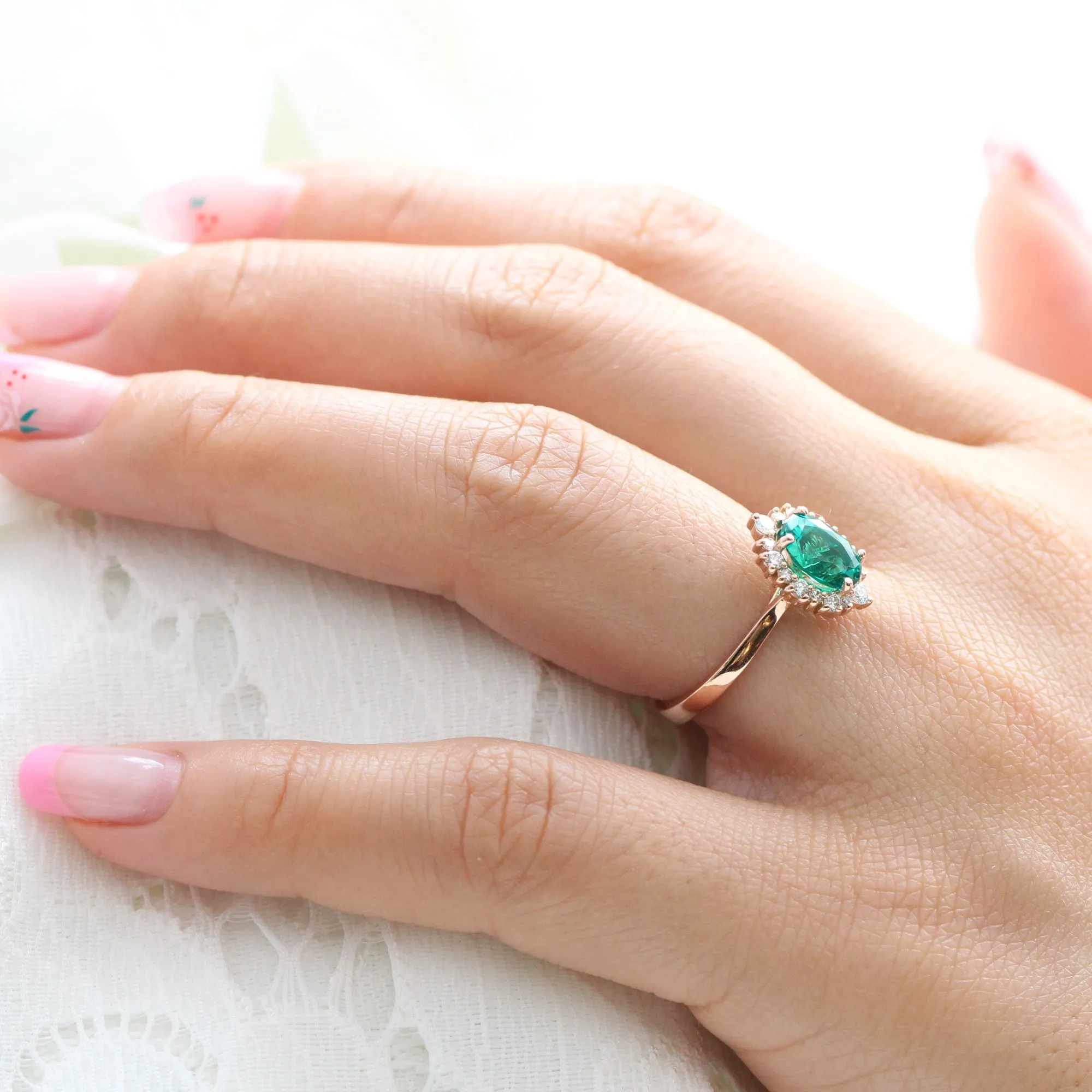 Oval Emerald Engagement Ring in Tiara Halo Diamond Tapered Band