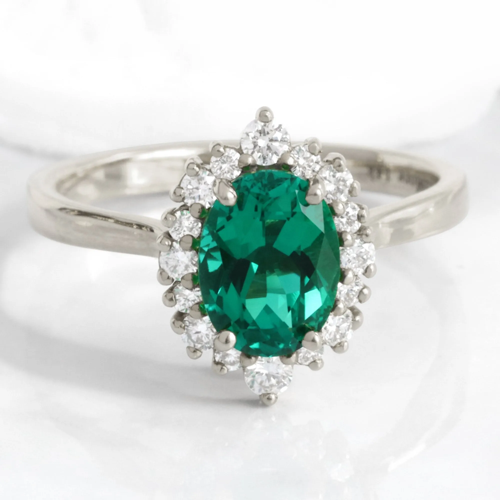 Oval Emerald Engagement Ring in Tiara Halo Diamond Tapered Band