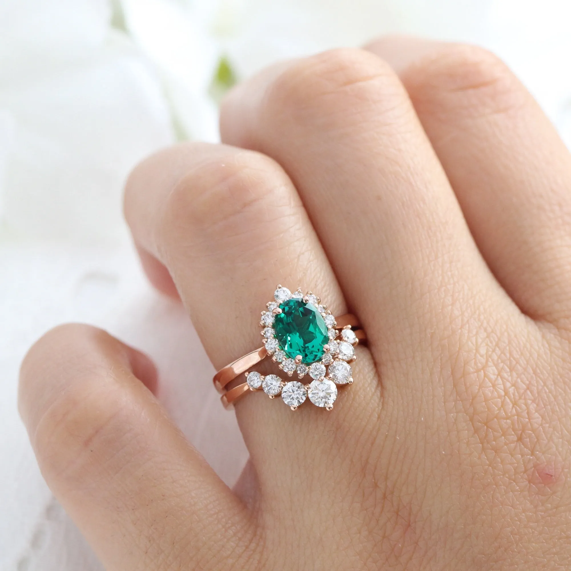 Oval Emerald Engagement Ring in Tiara Halo Diamond Tapered Band